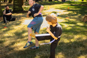 Students spar during our 2022 Kung Fu park Promotion.