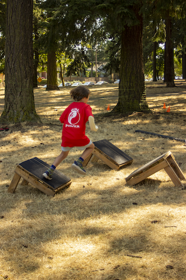 Students compete in our 2023 Kung Fu park obstacle course.
