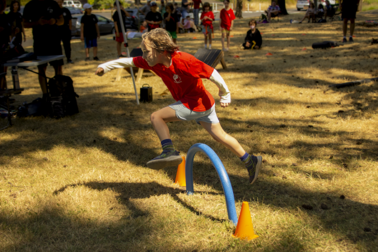 Students compete in our 2023 Kung Fu park obstacle course.