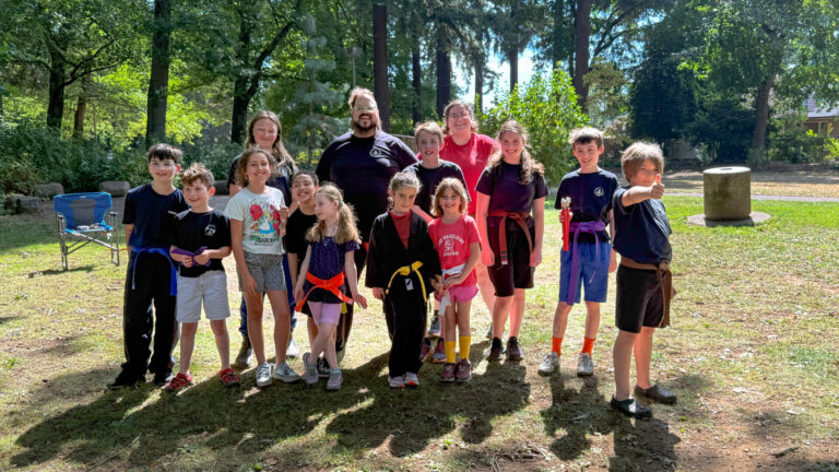 Kung fu students in a photo at the park